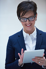 Image showing business woman working on tablet