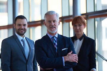 Image showing senior business man with his team at office