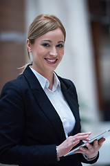 Image showing business woman working on tablet