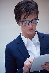 Image showing business woman working on tablet