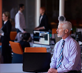 Image showing senior business man with his team at office