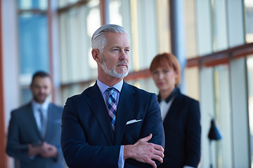 Image showing senior business man with his team at office