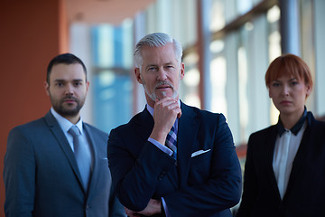 Image showing senior business man with his team at office