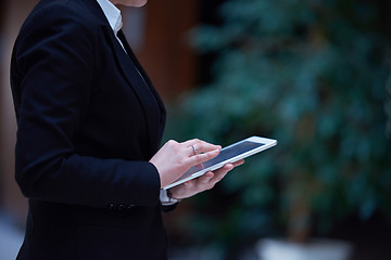 Image showing business woman working on tablet