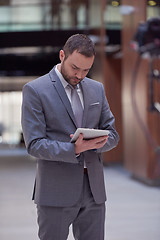 Image showing business man with tablet