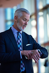 Image showing senior business man talk on mobile phone