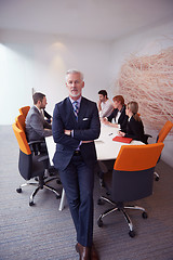 Image showing senior business man with his team at office