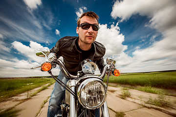 Image showing Biker on a motorcycle