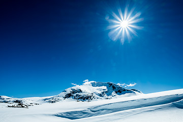 Image showing Sun and snowy mountain.