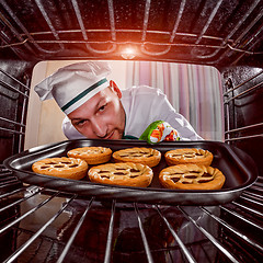 Image showing Chef cooking in the oven.