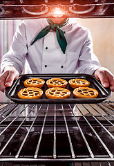 Image showing Chef cooking in the oven.