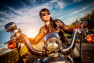 Image showing Biker girl on a motorcycle