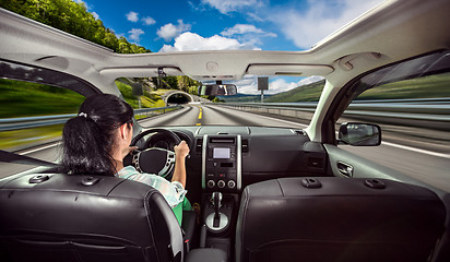 Image showing Woman behind the wheel of a car.