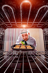 Image showing Chef cooking in the oven.