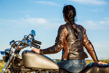 Image showing Biker girl on a motorcycle