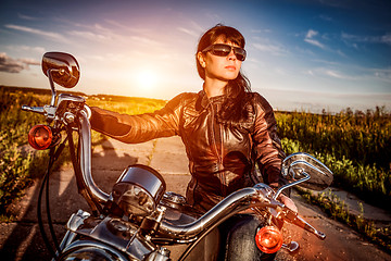 Image showing Biker girl on a motorcycle