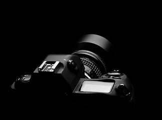 Image showing SLR camera on black spot light