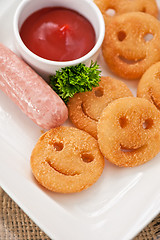 Image showing sausages with smiling potatoes