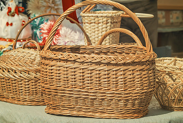 Image showing Wicker baskets for sale at the fair.