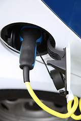 Image showing Electric car being charged at the station, close up of the power