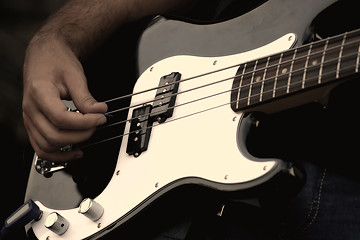 Image showing A musician playing electric guitar on concert