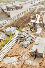 Image showing Worker levels provision of plate lifting by crane