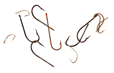 Image showing Rusty old fishhooks on white background