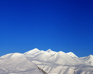 Image showing Snowy mountains and blue clear sky  in morning