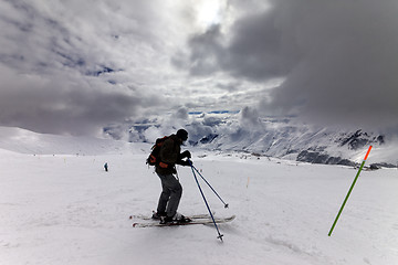 Image showing Skier on ski slope before storm