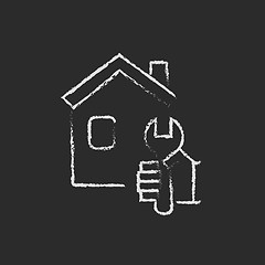 Image showing House repair icon drawn in chalk.