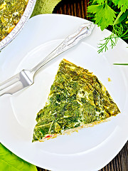 Image showing Pie celtic with spinach in plate on table top