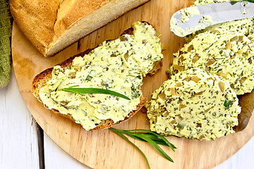 Image showing Sandwich with butter spinach and cucumbers on board top