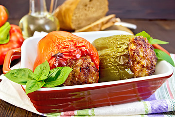 Image showing Pepper stuffed meat in brown roaster on table