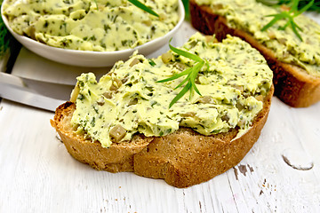 Image showing Sandwich with butter of spinach and cucumber on light board