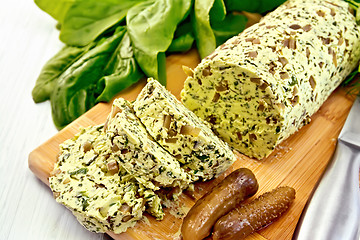 Image showing Butter with spinach and greens on light board