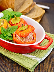 Image showing Pepper stuffed meat in red roaster on table