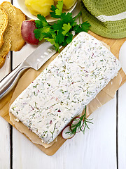 Image showing Terrine whole of curd and radish on paper and board top