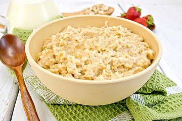 Image showing Oatmeal in bowl on light board