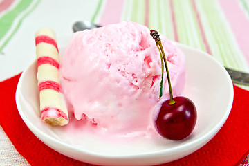 Image showing Ice cream cherry on red paper napkin with waffles