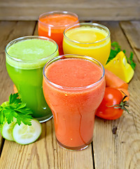 Image showing Juice tomato and vegetable in glassful on board