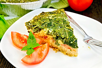 Image showing Pie celtic with spinach and tomatoes on table