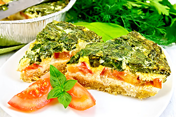 Image showing Pie celtic with spinach in plate on board