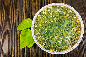 Image showing Pie celtic with spinach in form of foil on board