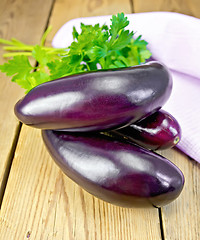 Image showing Eggplant with parsley on the board