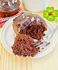 Image showing Cupcake chocolate with fork on board