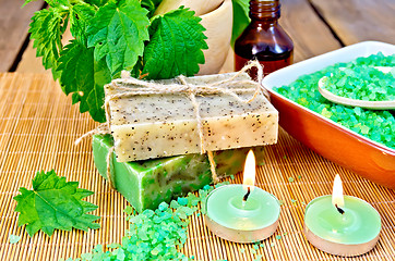 Image showing Soap homemade with nettles in mortar on board