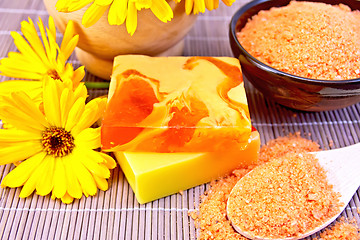 Image showing Soap homemade and salt with calendula on bamboo
