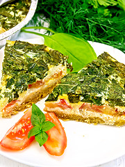 Image showing Pie celtic with spinach and tomato in plate on board