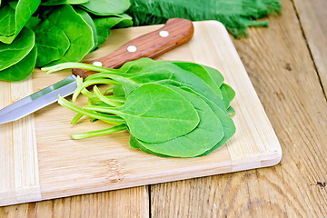 Image showing Spinach with knife on board