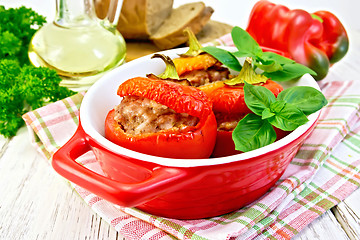 Image showing Pepper stuffed meat in red roaster on light board